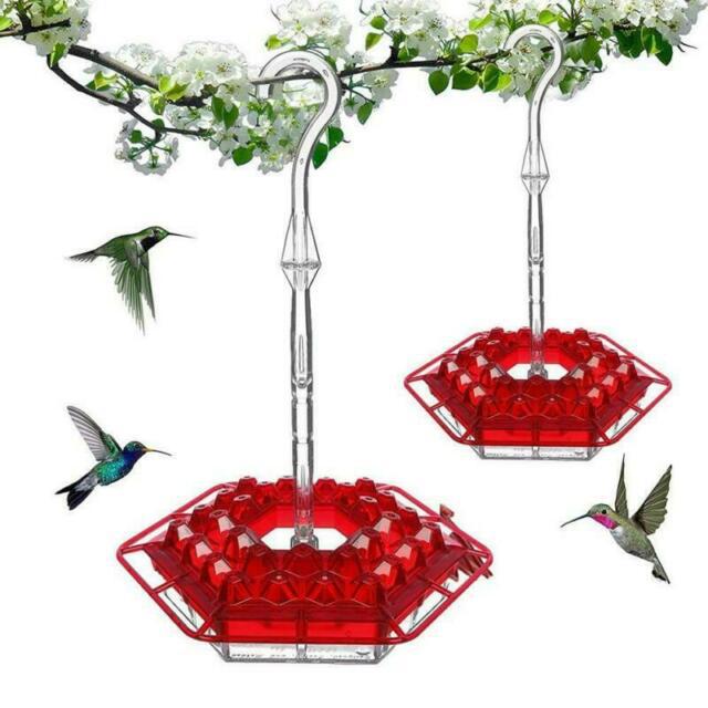 Red hexagonal hummingbird feeder with birds