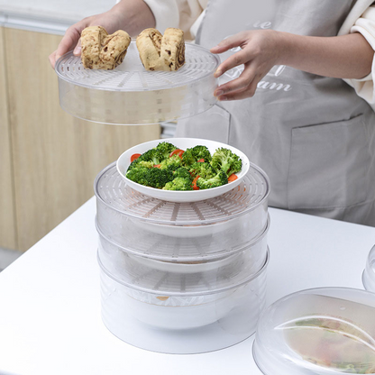 Person placing the top dome cover onto the stacked food trays