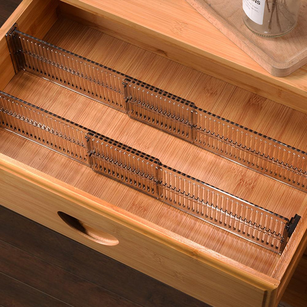 Adjustable drawer dividers organized inside a wooden drawer