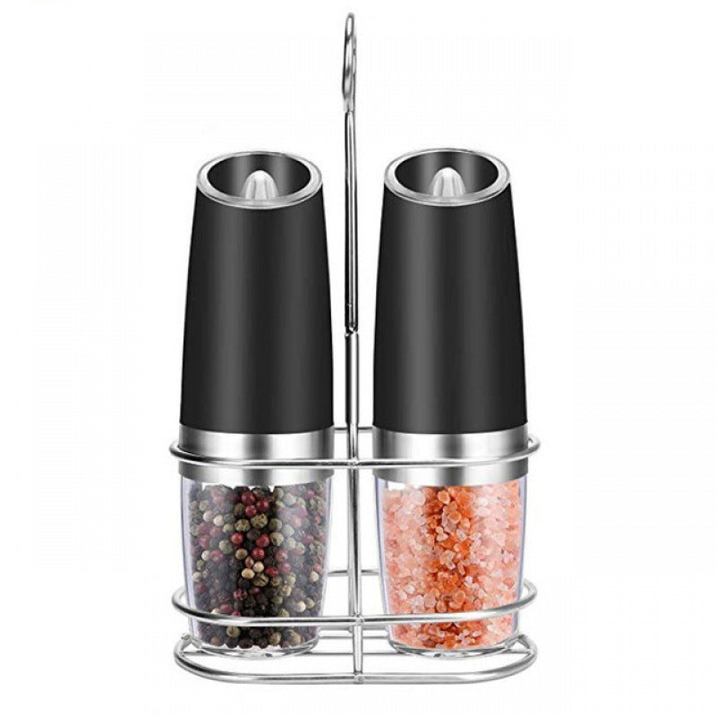 Set of two gravity electric spice grinders in a metal stand