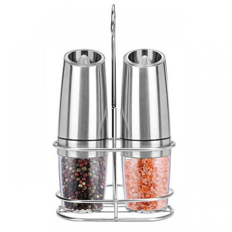 Set of two silver gravity electric spice grinders in a stand