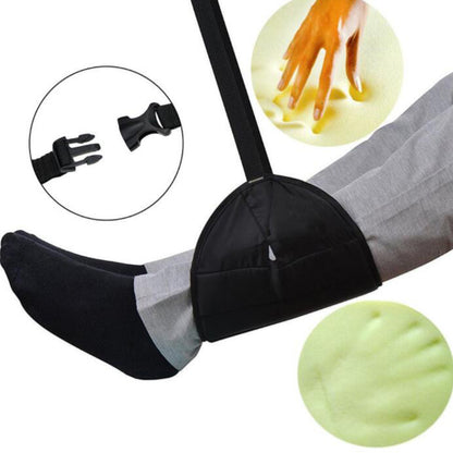 Person resting their feet in the under desk foot hammock