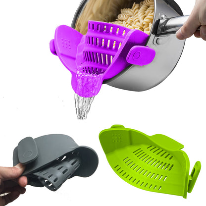 Purple clip-on silicone strainer attached to a pot
