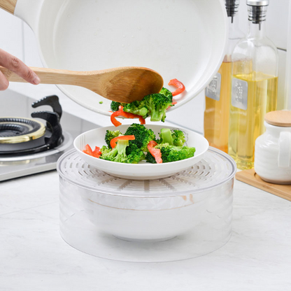 Pouring vegetables onto a plate on the food cover base