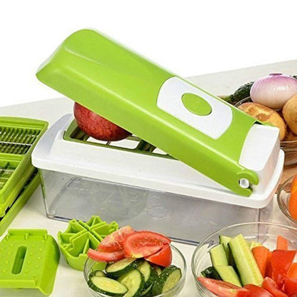 Close up of pushing an apple through the green vegetable chopper