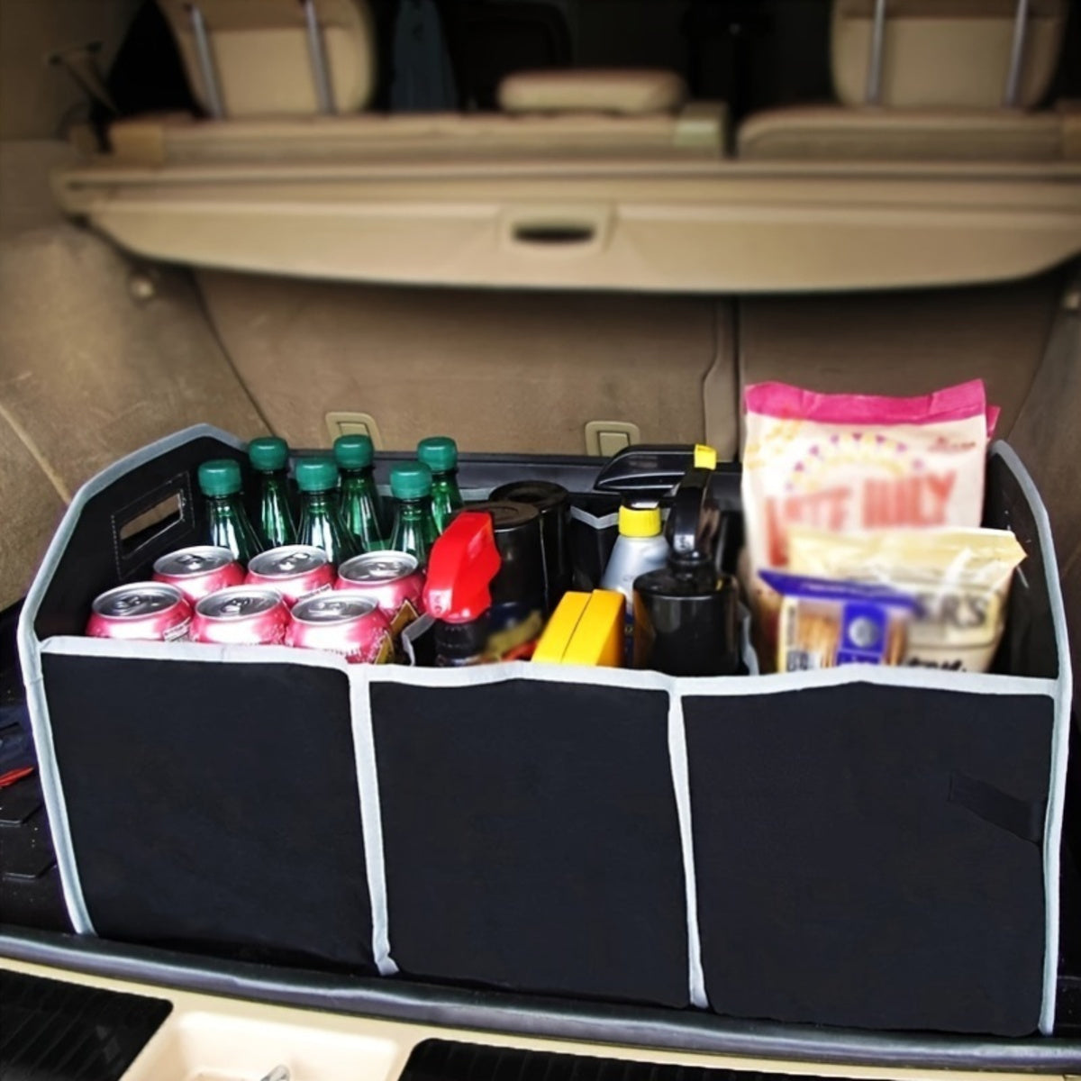 Person placing trunk organizer into car trunk