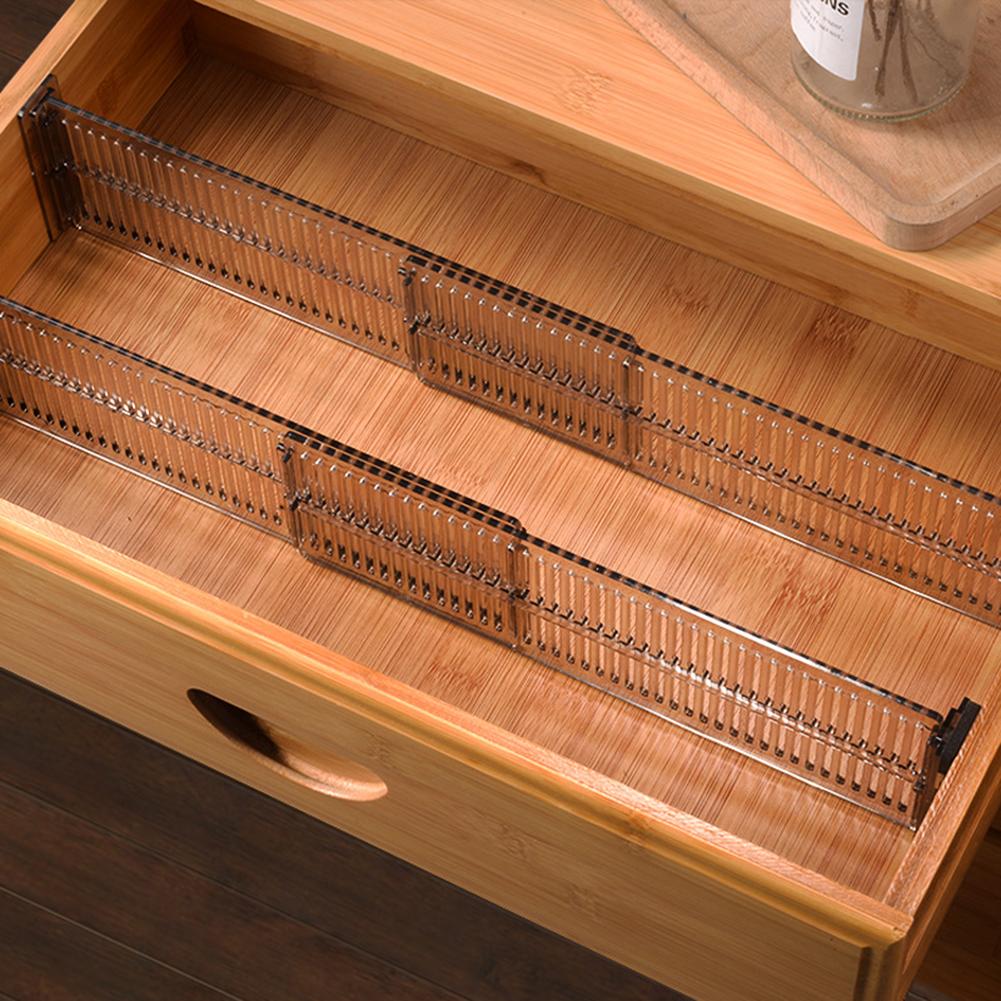 Clear adjustable drawer dividers separating compartments
