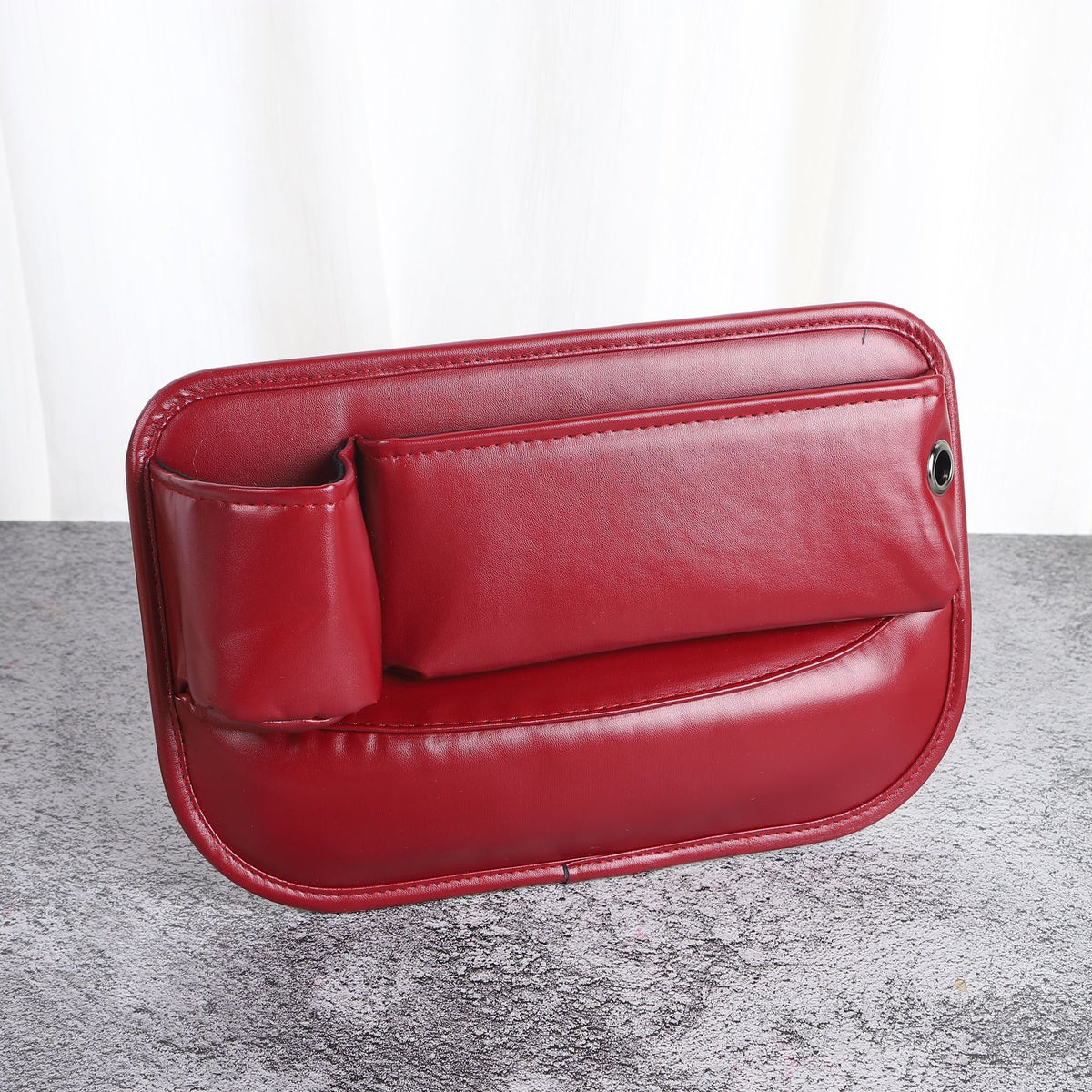 Red faux leather car seat gap filler organizer
