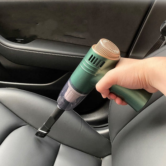 Handheld cordless car vacuum in use on car seat
