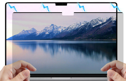 Person attaching magnetic privacy screen to laptop