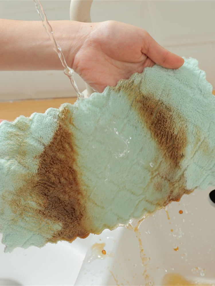 Washing a dirty dishcloth under running water