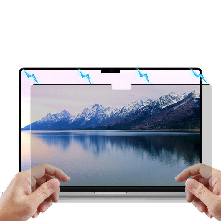Person attaching magnetic privacy screen to laptop