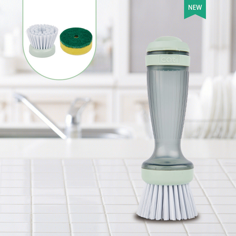 Soap dispensing dish brush standing upright on a kitchen counter