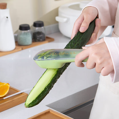 Peeling a cucumber with the green vegetable peeler with storage tube