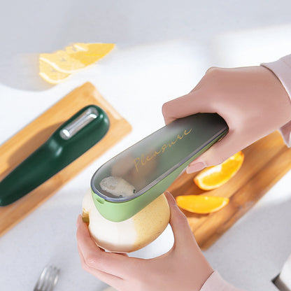 Peeling a pear with the vegetable peeler with storage tube