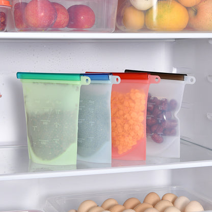 Multiple silicone bags filled with food standing in a refrigerator