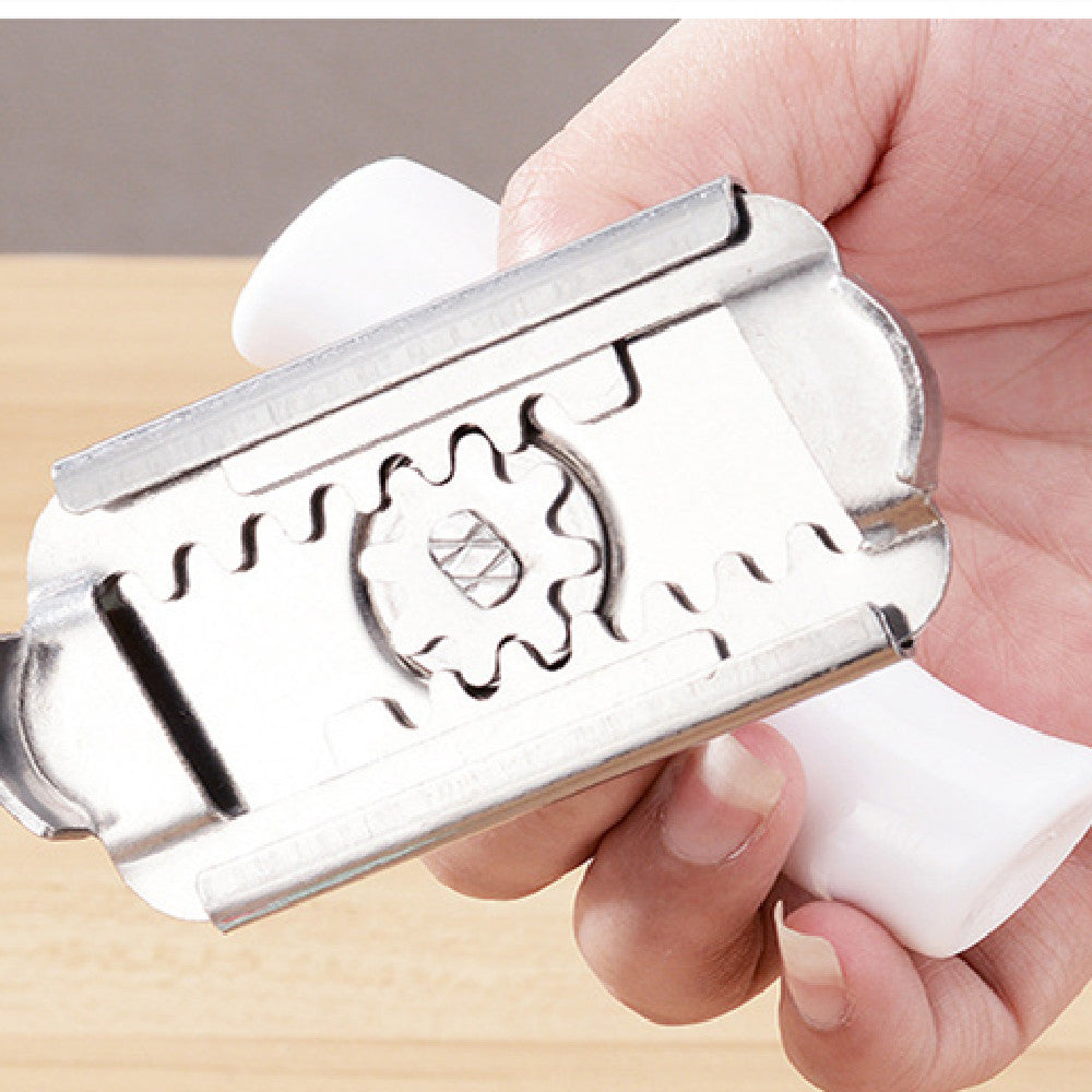 Underside of the adjustable jar opener showing the steel gear mechanism