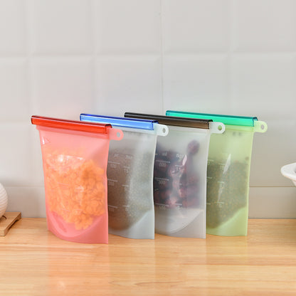 Four colored silicone storage bags filled with beans on a counter