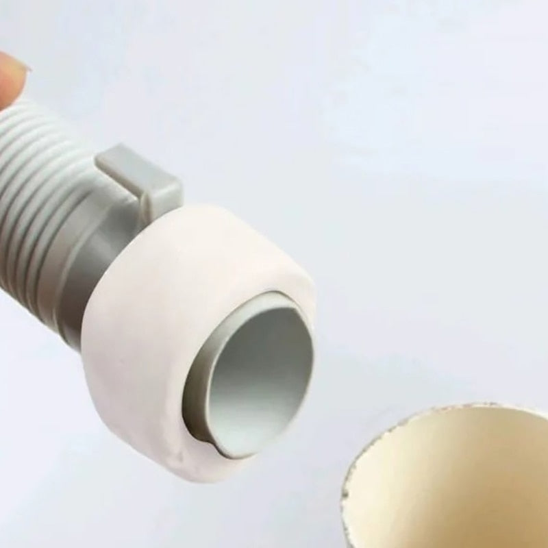 Moldable sealant clay applied to a household sewer pipe gap