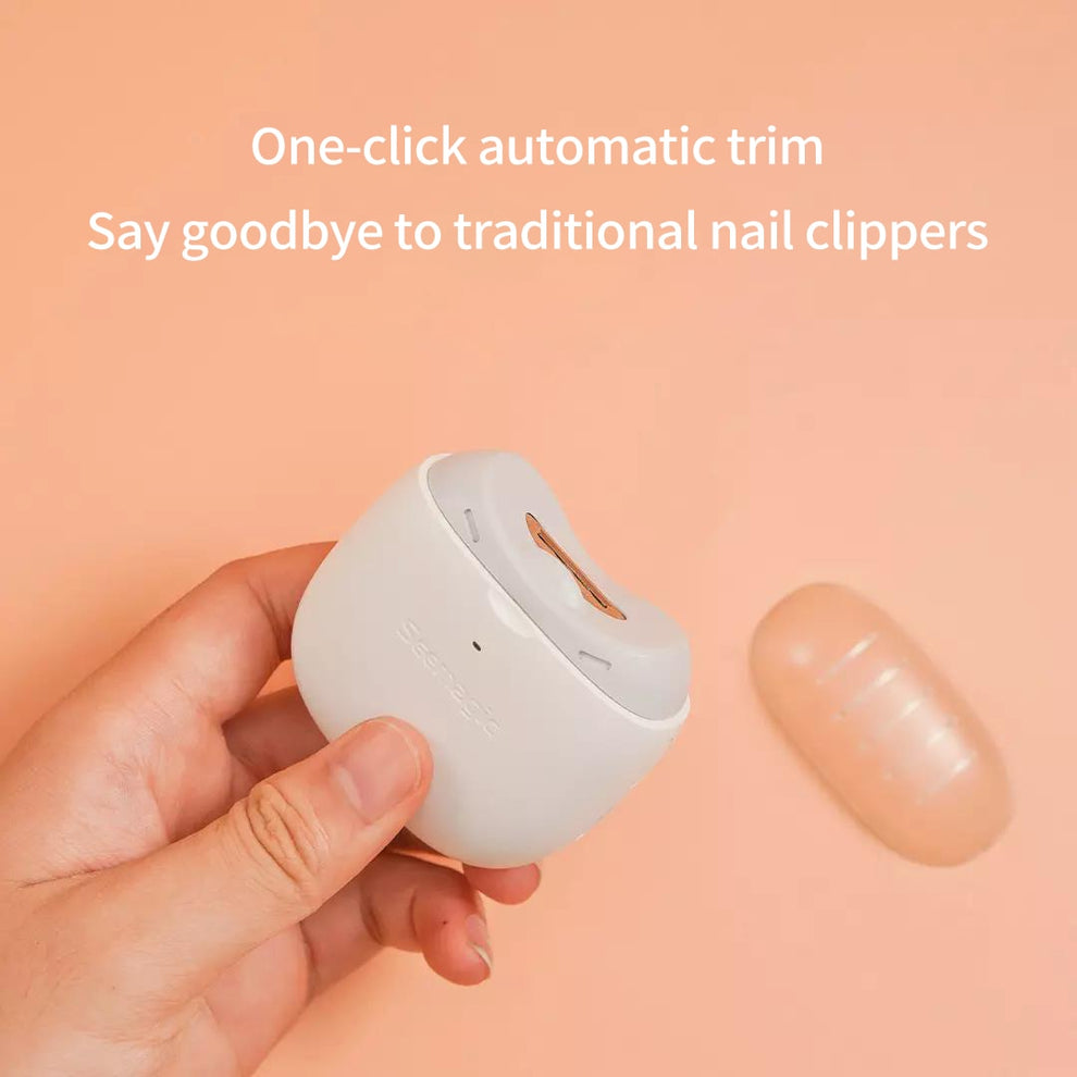 Automatic nail clipper device resting on a flat, clean surface