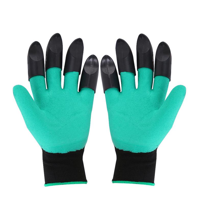 Close-up of flexible green gardening gloves holding a small plant