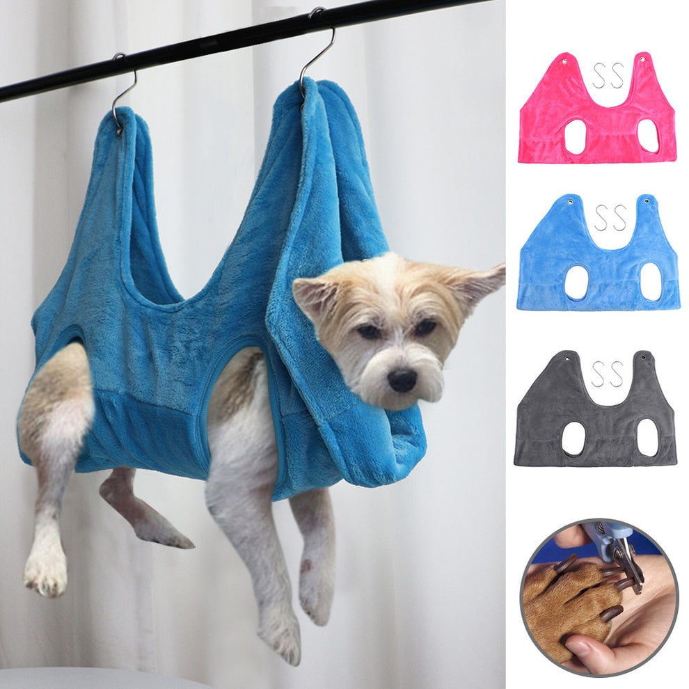 Pet resting comfortably in grooming hammock during nail trim