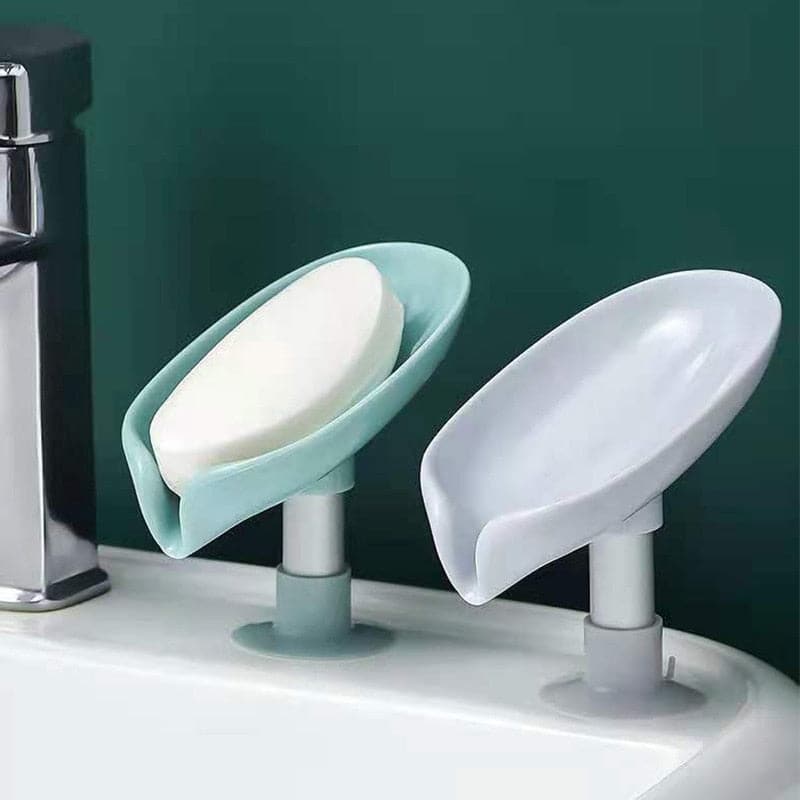 Gray leaf shaped soap holder with water draining out