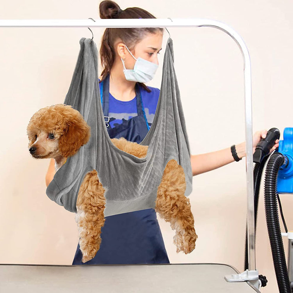 Pet owner easily hanging the grooming hammock