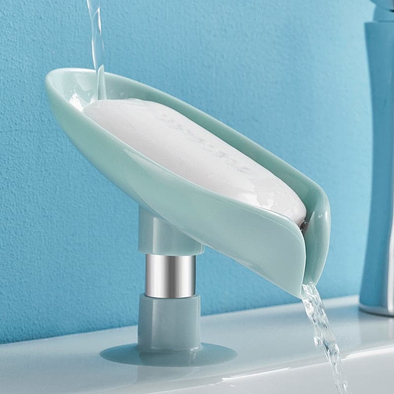 Gray leaf soap dish holding a bar of soap