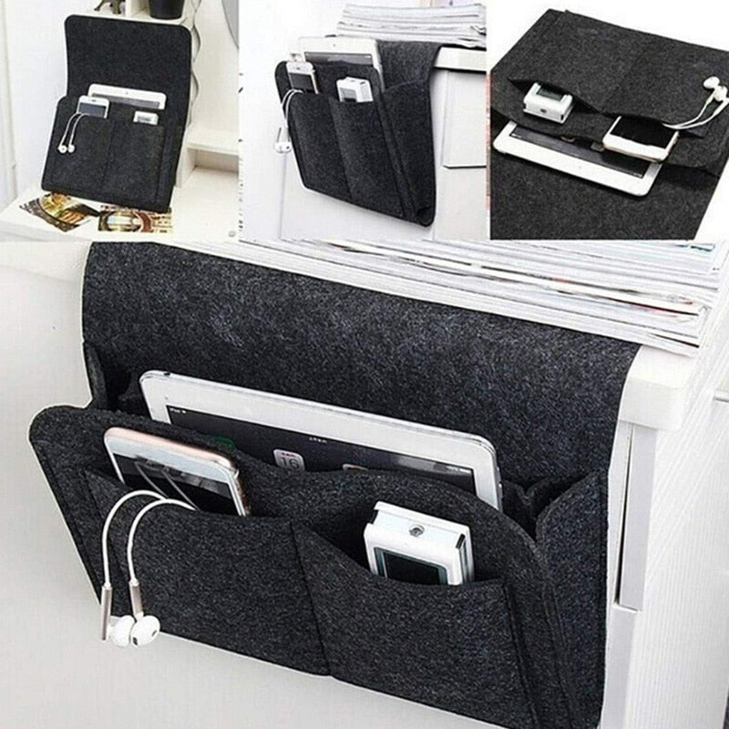 Dark gray bedside storage caddy next to a sleeping area
