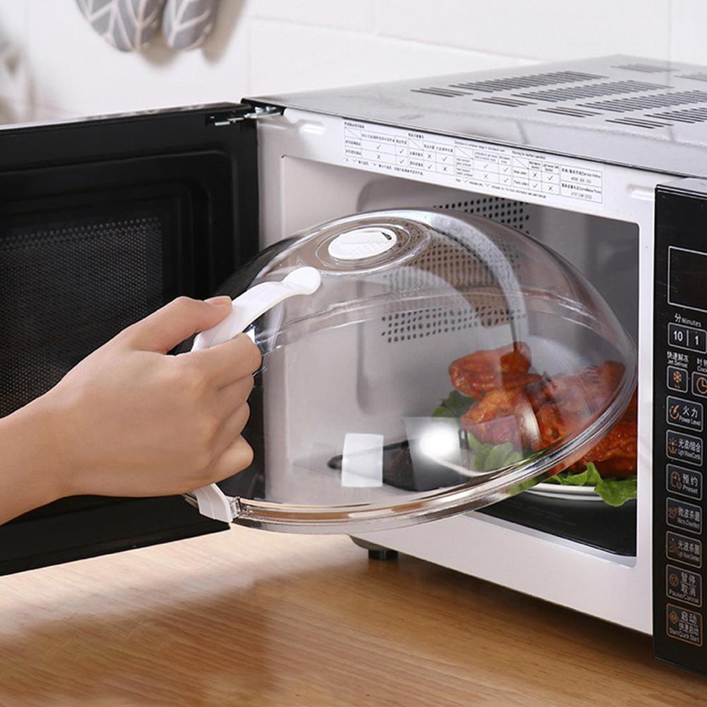 Vented splatter-proof microwave food cover over a plate.