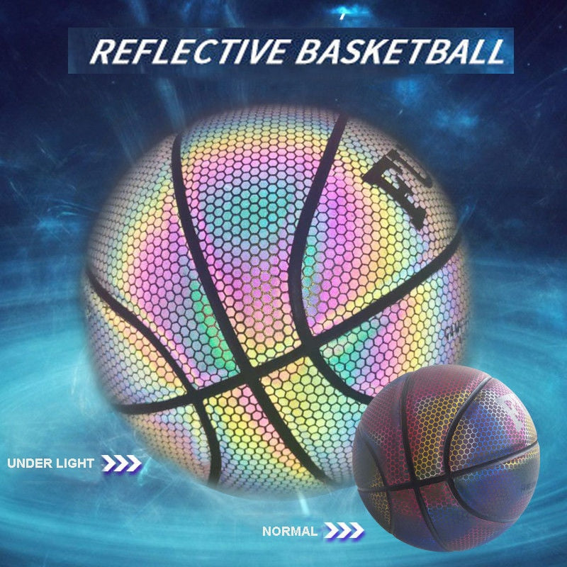Glowing reflective basketball in mid-air heading toward a hoop at night