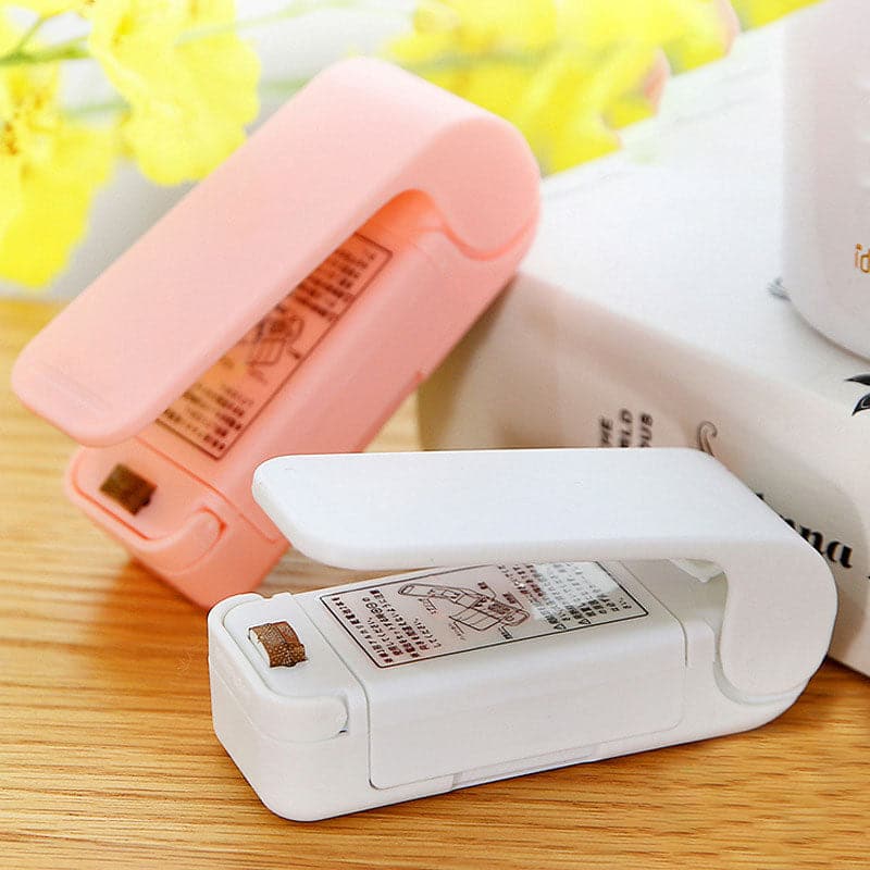 White variant of the portable bag sealing device ready for use