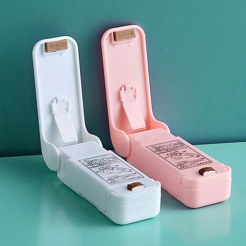 Storing a mini food sealer inside a clean, organized kitchen drawer