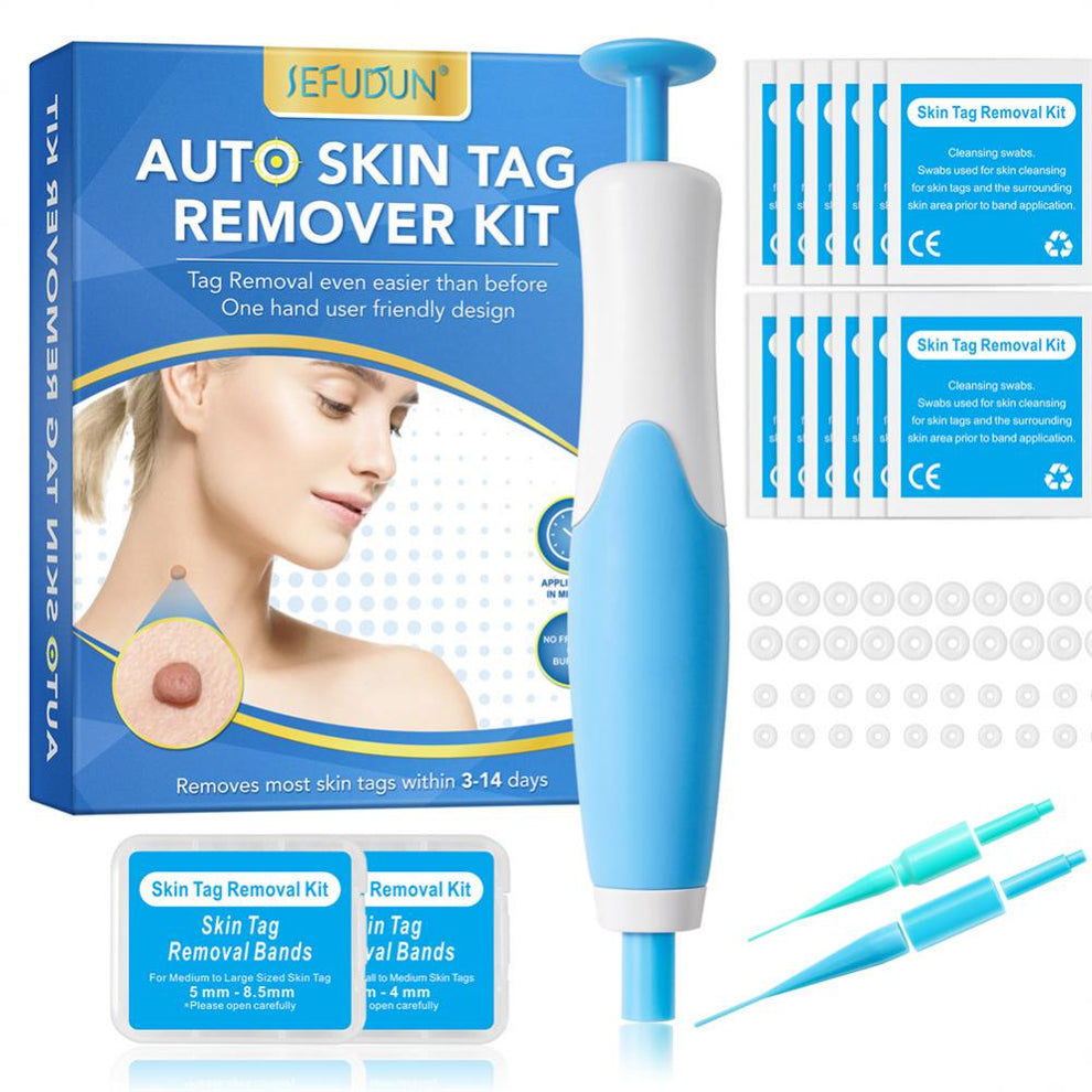 Skin tag remover kit applicator tool and bands on a clean surface.