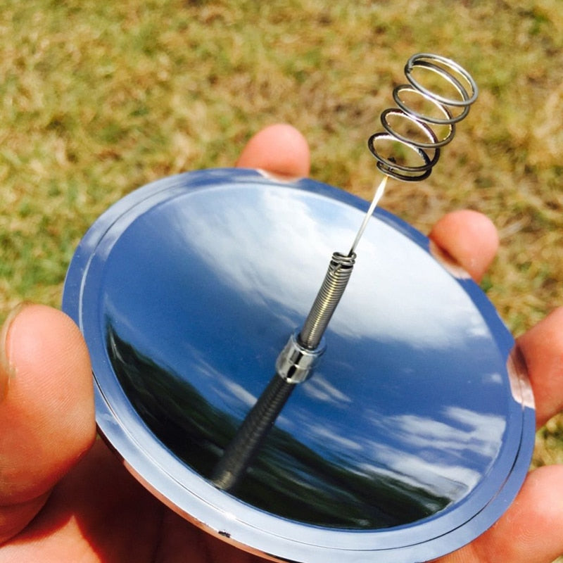 Small pocket lighter resting next to essential camping gear